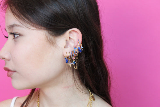 she is wearing gold huggie earring