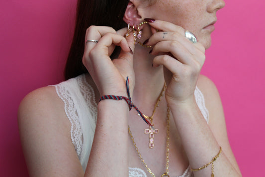 she is wearing gold huggie earring