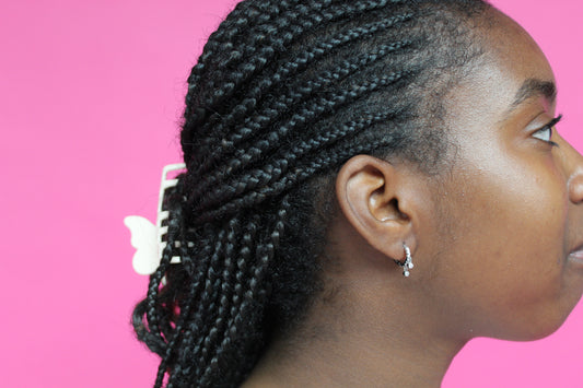 she is wearing gold huggie earring