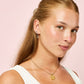 Camilla Blue Gold Cross Huggie Earrings