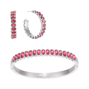 A Bijoux De Mimi jewellery set featuring a silver bangle bracelet and matching hoop earrings, both adorned with a row of oval-cut pink gemstones.