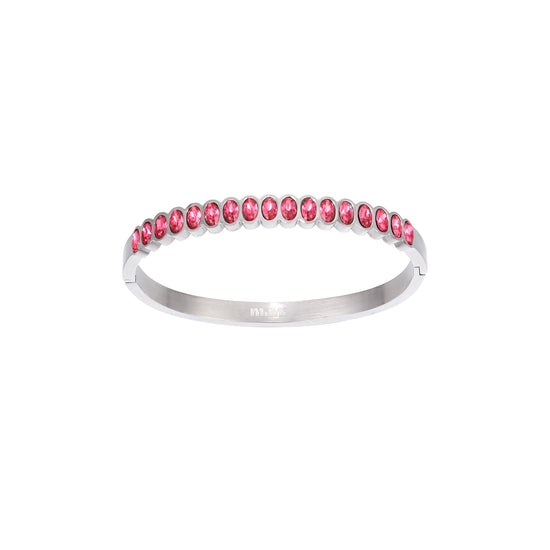 A Bijoux De Mimi silver bangle bracelet featuring a row of small oval-cut pink gemstones.