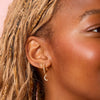 Tori Crystal Moon Huggie Earrings
